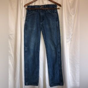 Medium wash “Wrangler” jeans.